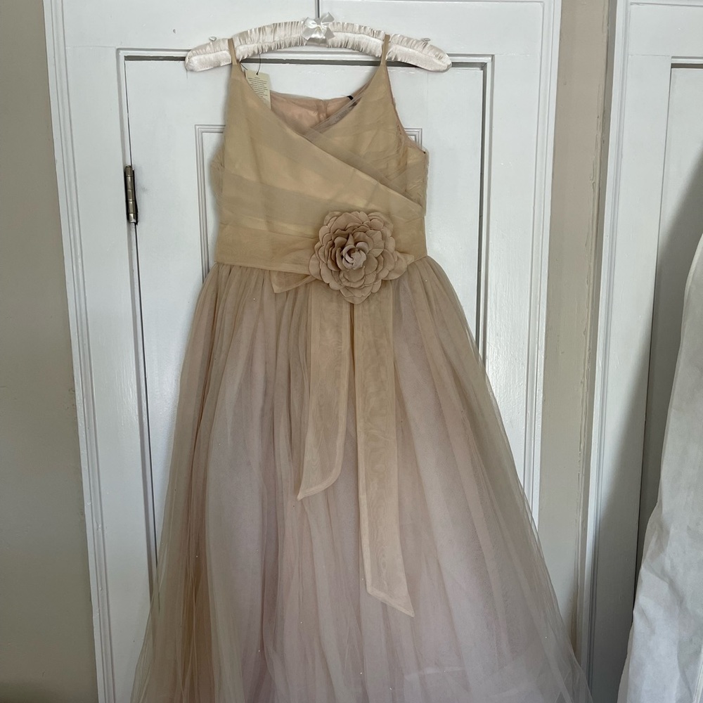 Three flower girl dressed. Never worn brought from UK. Sizes 14,13,12 $60 EACH
